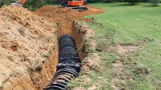 Installing a septic system chamber system Infiltrator drain field [upl. by Rosenberger787]